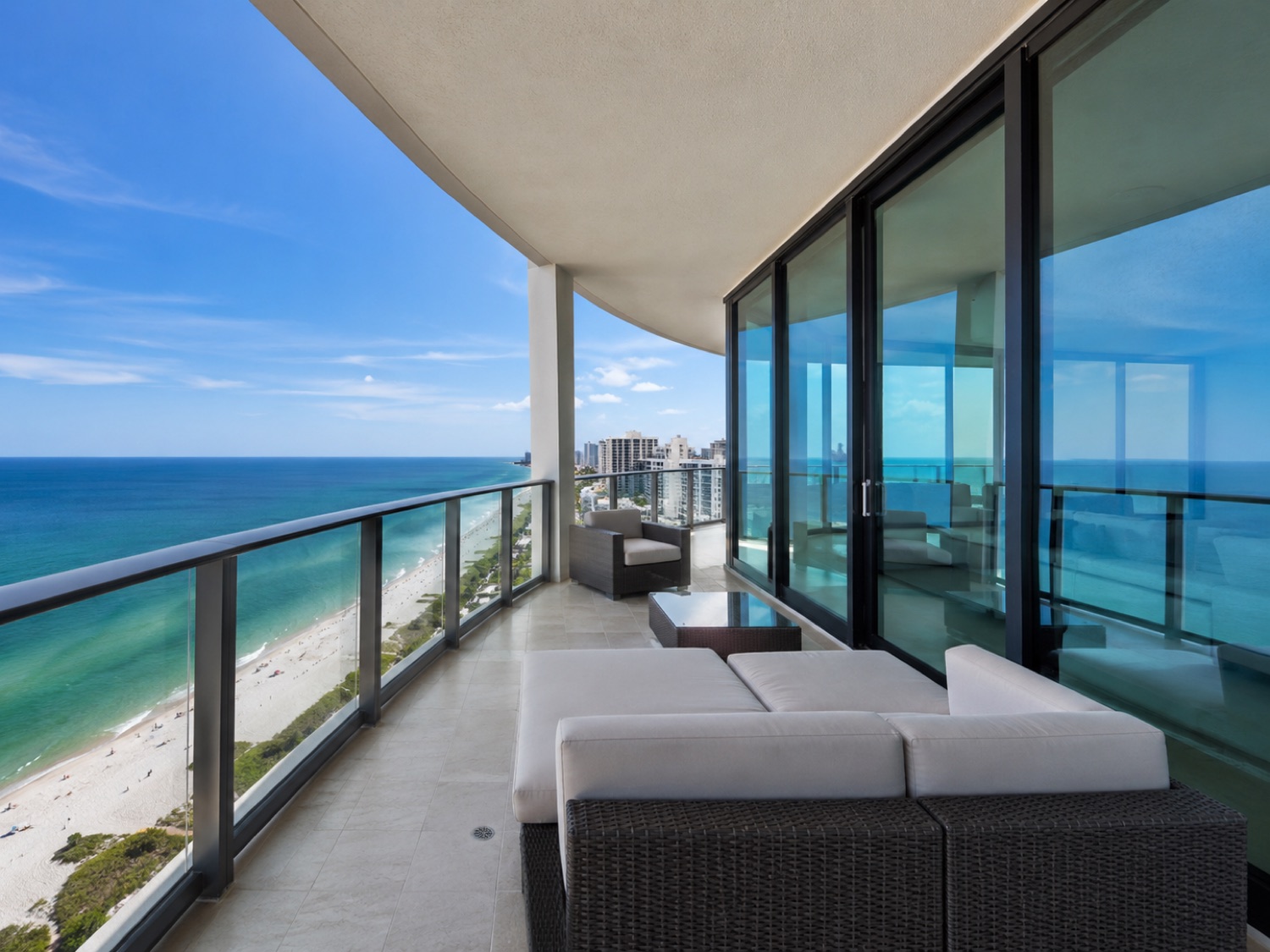 High-rise condo balcony with new impact sliding doors